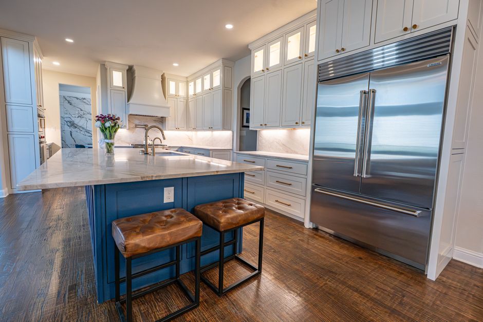 Spacious Colleyville kitchen featuring marble countertops, a center island, stainless steel appliances